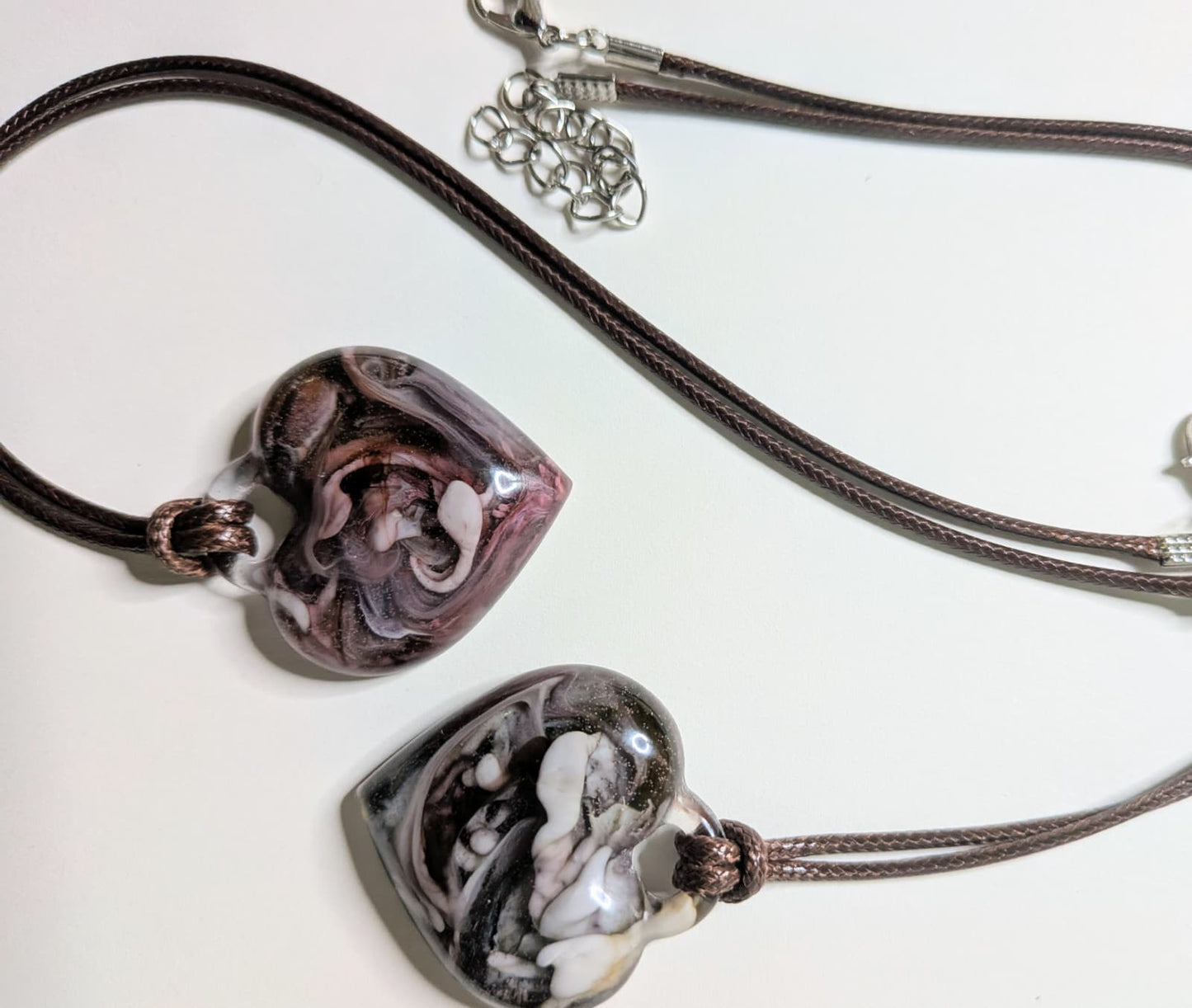 2 heart-shaped epoxy resin pendants