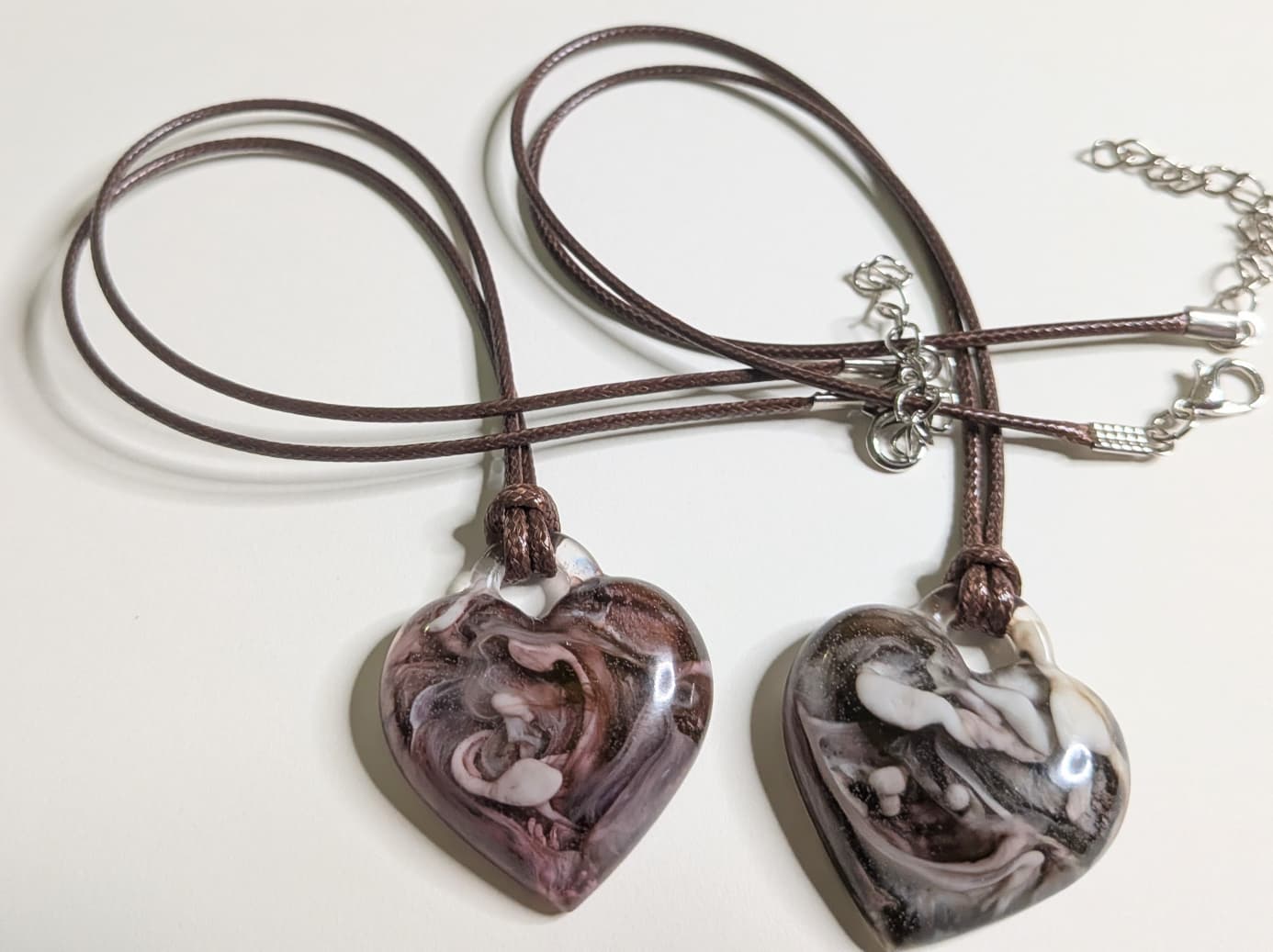 2 heart-shaped epoxy resin pendants