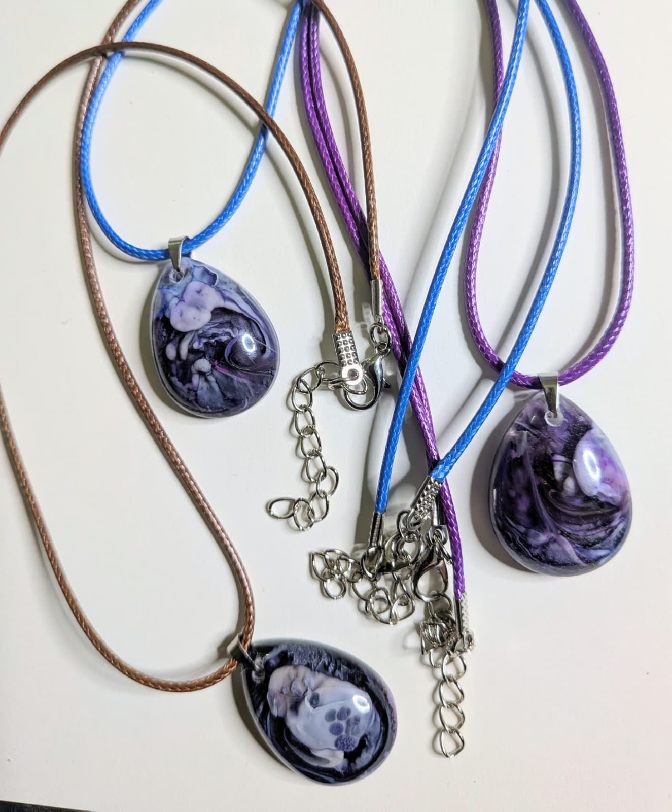 3 resin pendants designed with a petri dish effect
